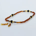 Adult Baltic Amber Bracelet with Lava Stone Mala Tassel. MT04
