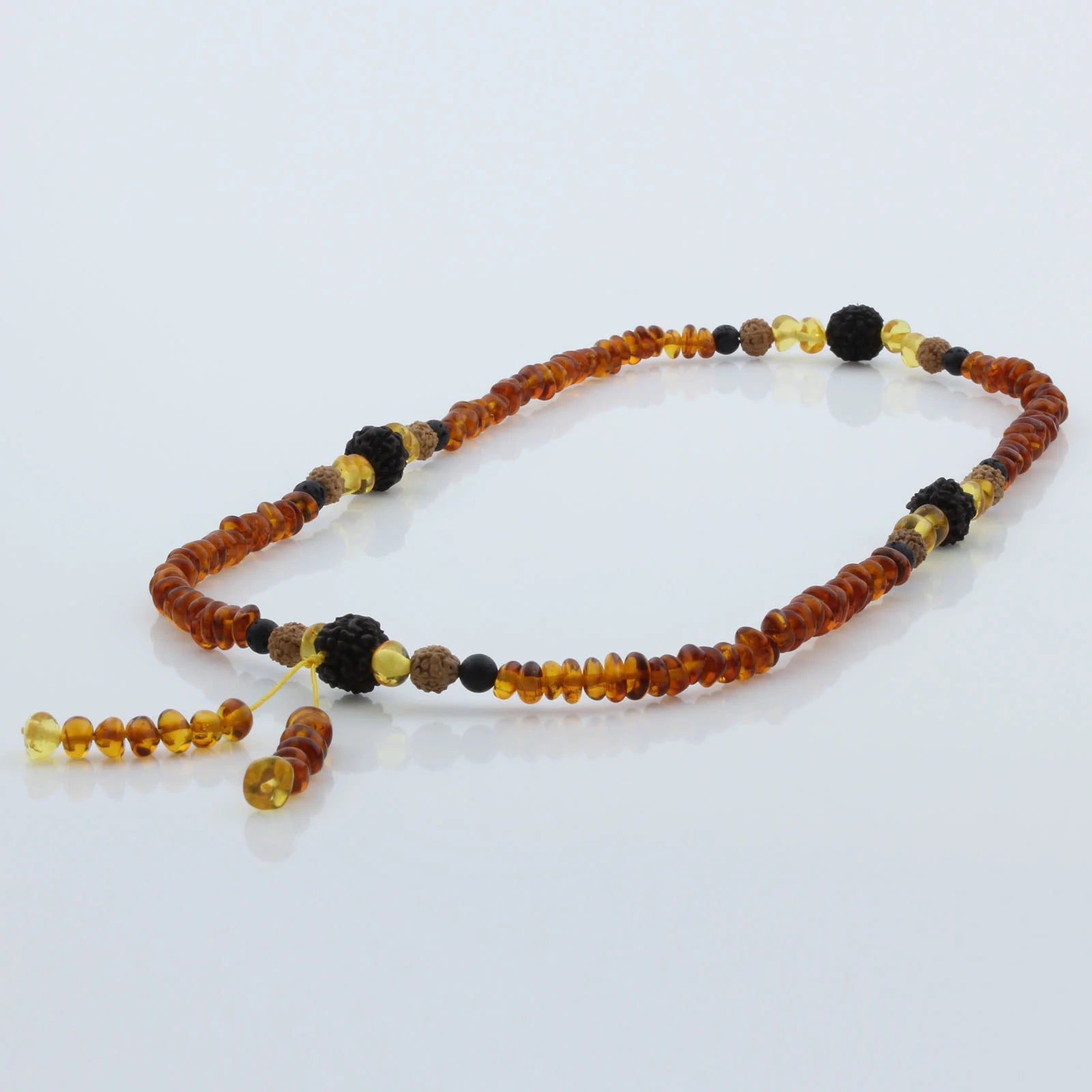 Adult Baltic Amber Bracelet with Lava Stone Mala Tassel. MT04