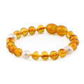 Baltic amber baroque children's bracelet with freshwater pearl, 14cm